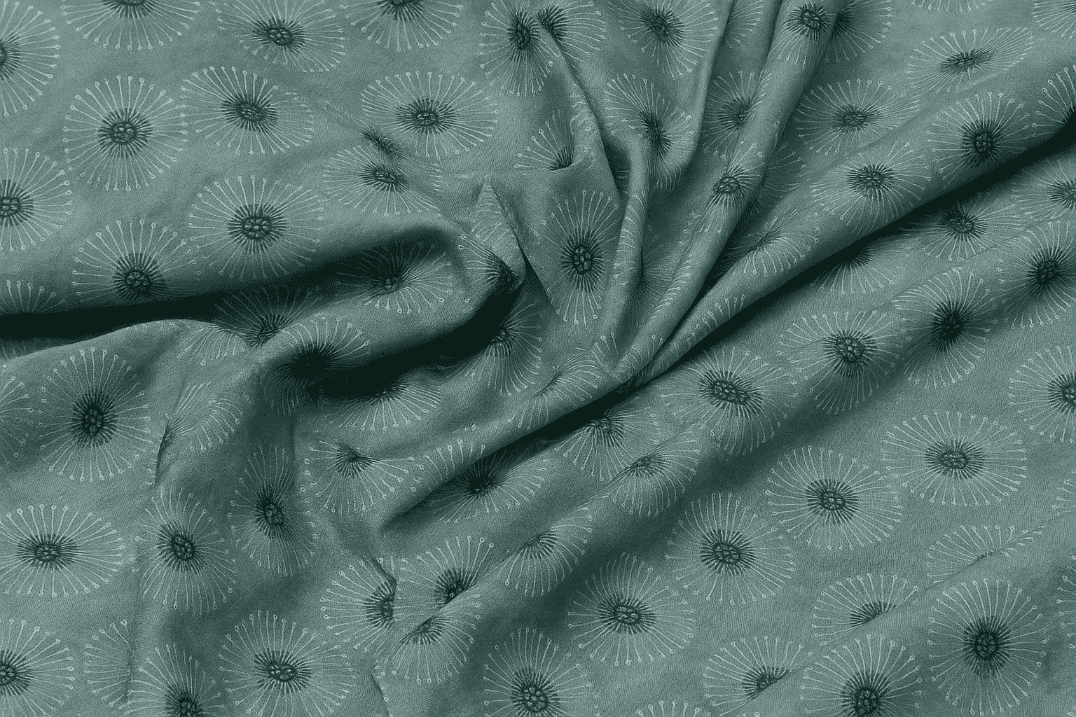 Textured fabric with a subtle pattern on a green background
