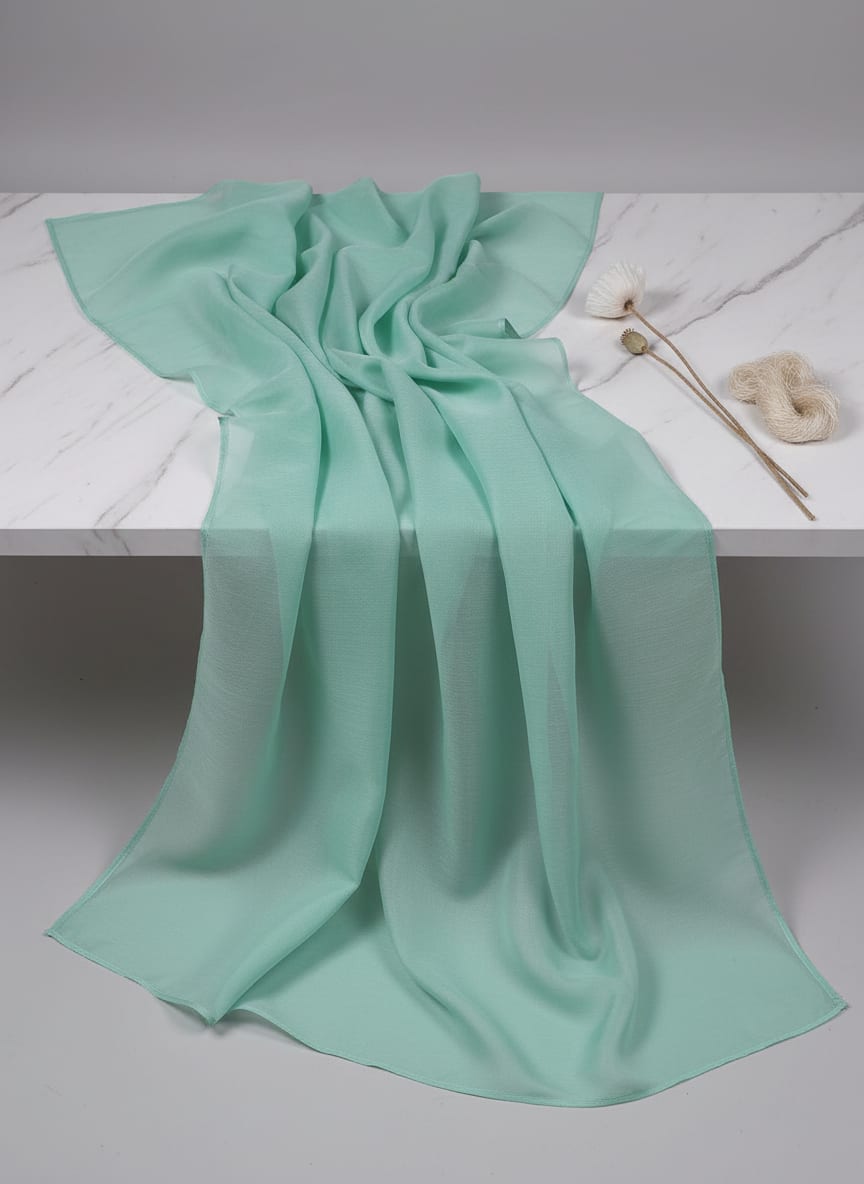 A whisper of colour and light, this fabric drapes with ethereal, liquid elegance.