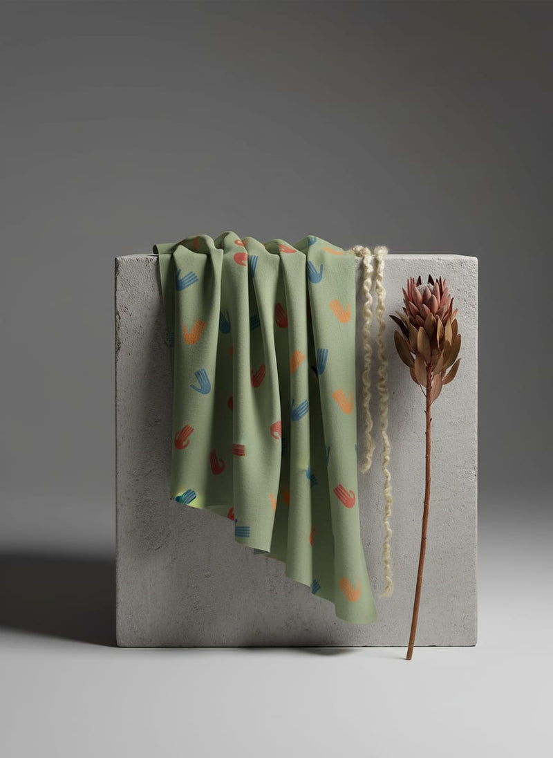 Green Muslin Digital Printed Fabric With Quirky Kids Hand Prints