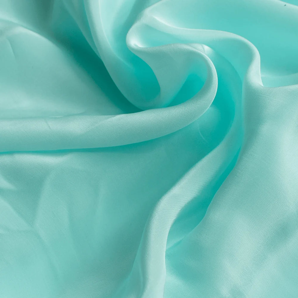 Experience the sublime fluidity and gentle caress of this exquisitely crafted viscose crepe.