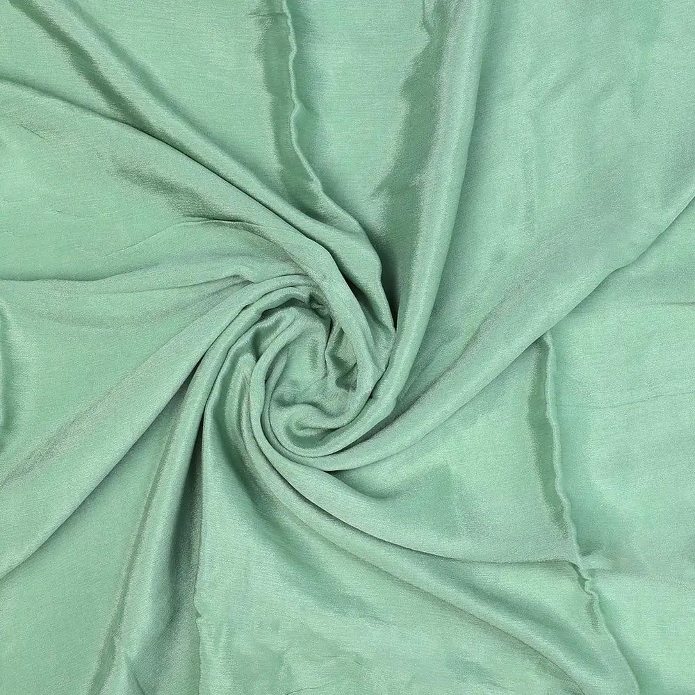 Discover a fabric that moves with liquid grace and a soft, pearlescent glow.